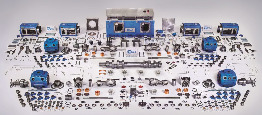 Blog series by Compass Energy Systems with a picture showing a gas compressor parts laid out on a table. 